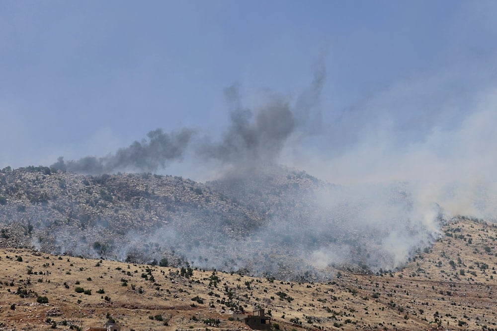 Smoke rises from fires that erupted at open hills by Israeli shelling, in Chebaa, south Lebanon, June 14, 2024 (AP)