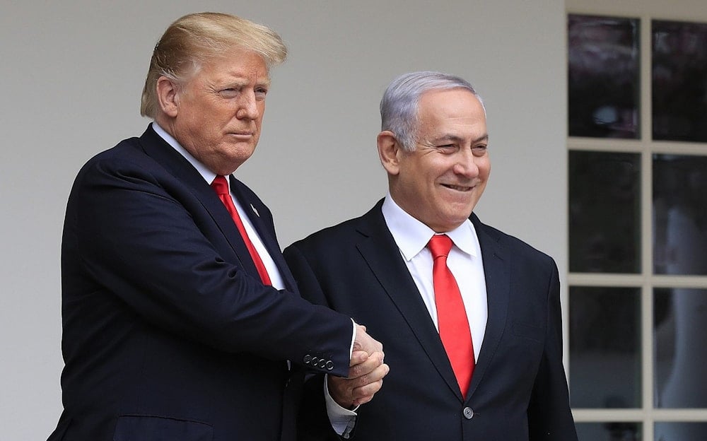 Former US President Donald Trump welcomes Israeli Prime Minister Benjamin Netanyahu to the White House in Washington, March 25, 2019. (AP)