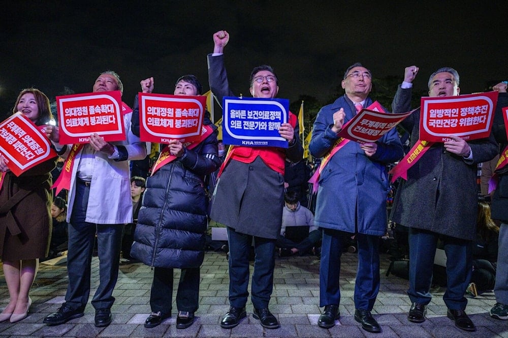 Doctors protest against the government’s plan to raise the annual enrollment quota at medical schools in Seoul, February 15, 2024. (AFP)