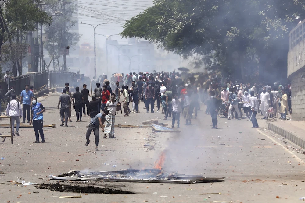 Students clash with riot police during a protest against a quota system for government jobs, in Dhaka, Bangladesh, Thursday, July 18, 2024. (AP)