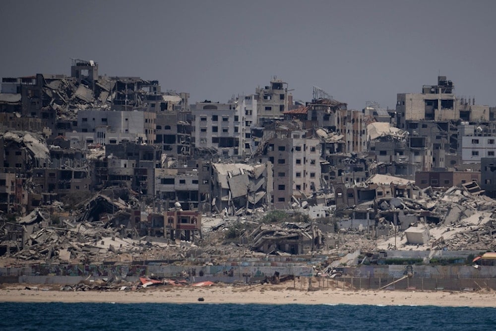 Destroyed buildings stand in the coast of the Gaza Strip, Tuesday, June 25, 2024. (AP Photo/Leo Correa)