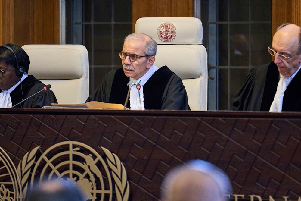 Presiding ICJ Judge Nawaf Salam reads the ruling in the International Court of Justice, or World Court, in The Hague, Netherlands, Friday July 19, 2024, as the United Nations top court is delivering a non-binding advisory opinion. (AP)