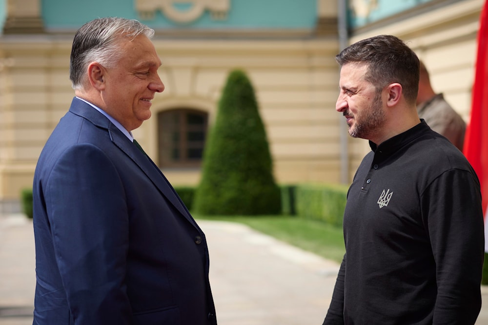 In this photo provided by the Ukrainian Presidential Press Office, Ukrainian President Volodymyr Zelensky, right, welcomes Hungarian Prime Minister Viktor Orban in Kiev, Ukraine, July 2, 2024 (Ukrainian Presidential Press Office via AP) 