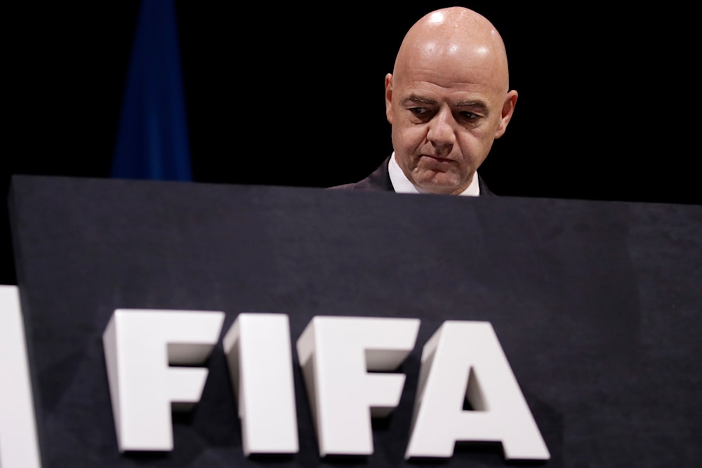 FIFA President Gianni Infantino walks on the stage before the start of the 69th FIFA congress in Paris, June 5, 2019 (AP)