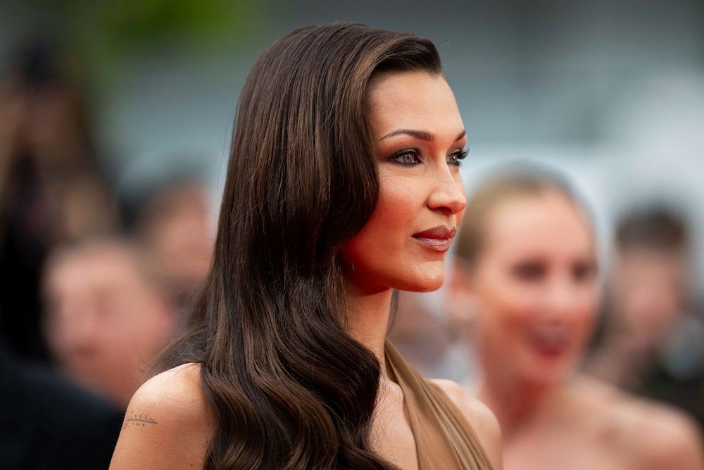 Bella Hadid poses for photographers upon arrival at the premiere of the film 'The Apprentice' at the 77th International Film Festival, Cannes, southern France, May 20, 2024 (Invision via AP)