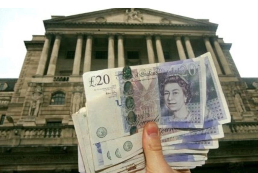 A person holding the British pound (AFP)