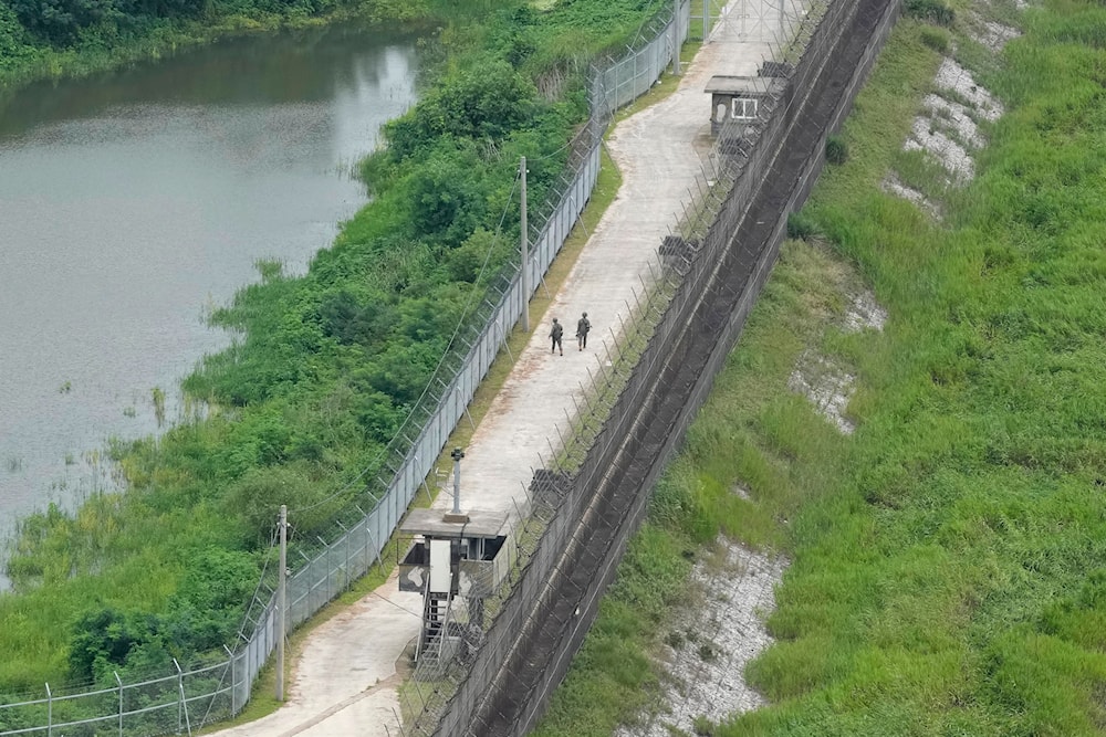 South Korean army soldiers patrol along the barbed-wire fence in Paju, South Korea, near the border with North Korea, Sunday, July 21, 2024. (AP)