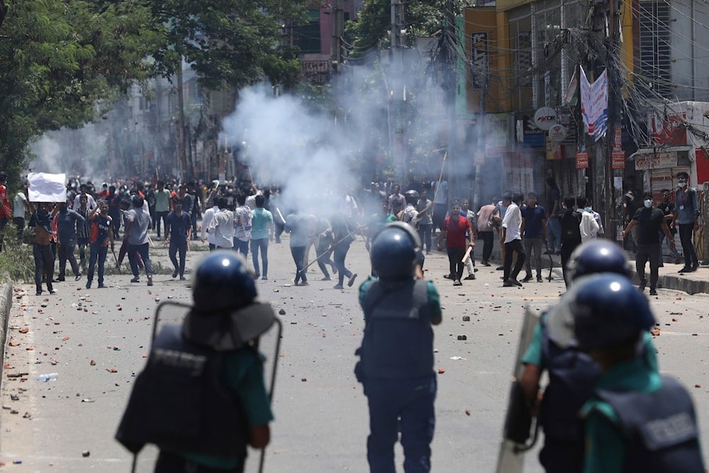 Students clash with riot police during a protest against a quota system for government jobs, in Dhaka, Bangladesh, Thursday, July 18, 2024. (AP)