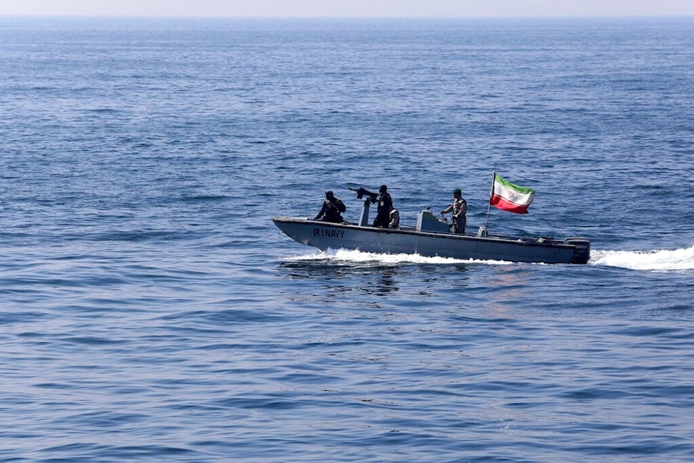 In this photo released Feb. 17, 2021, an Iranian naval vessel flying an Iranian flag participates in a joint naval exercise of the Russian Navy, the Iranian navy and the Iranian Revolutionary Guard's navy in the Indian Ocean. (Iranian Army via AP)