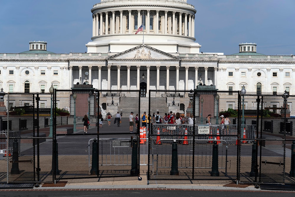 The U.S. Capitol is seen behind a security fence a day before of Israel's Prime Minister Benjamin Netanyahu visit to Capitol Hill, Tuesday, July 23, 2024, in Washington. (AP)