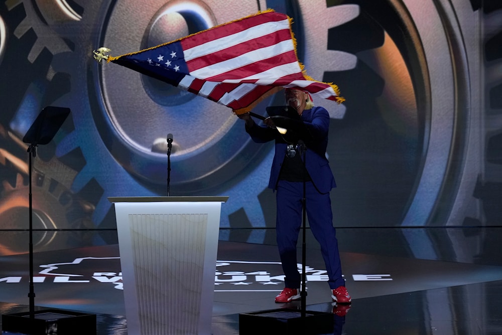 Hulk Hogan waving US flag while on stage during the Republican National Convention on Thursday, July 18, 2024, in Milwaukee. (AP)