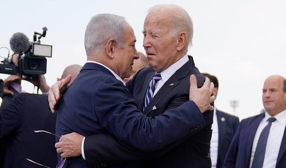 US President Joe Biden is greeted by Israeli occupation Prime Minister Benjamin Netanyahu after arriving at Ben Gurion International Airport, Oct. 18, 2023, in Tel Aviv, 'Israel'. (AP)