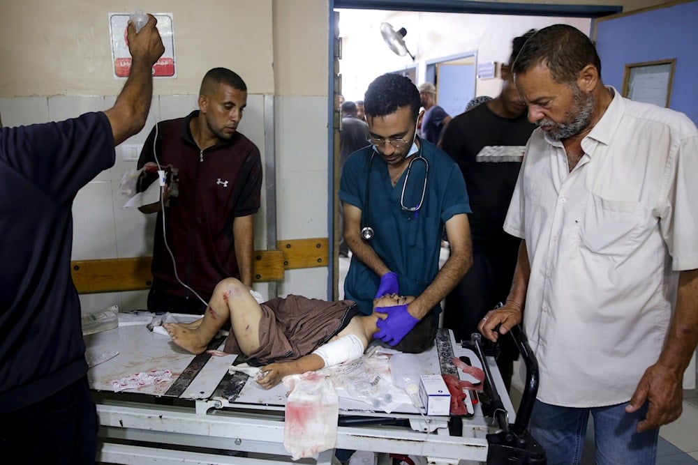 A Palestinian boy wounded in the Israeli bombardment of the Gaza Strip is treated in a hospital in Khan Younis, on July 9, 2024. (AP)