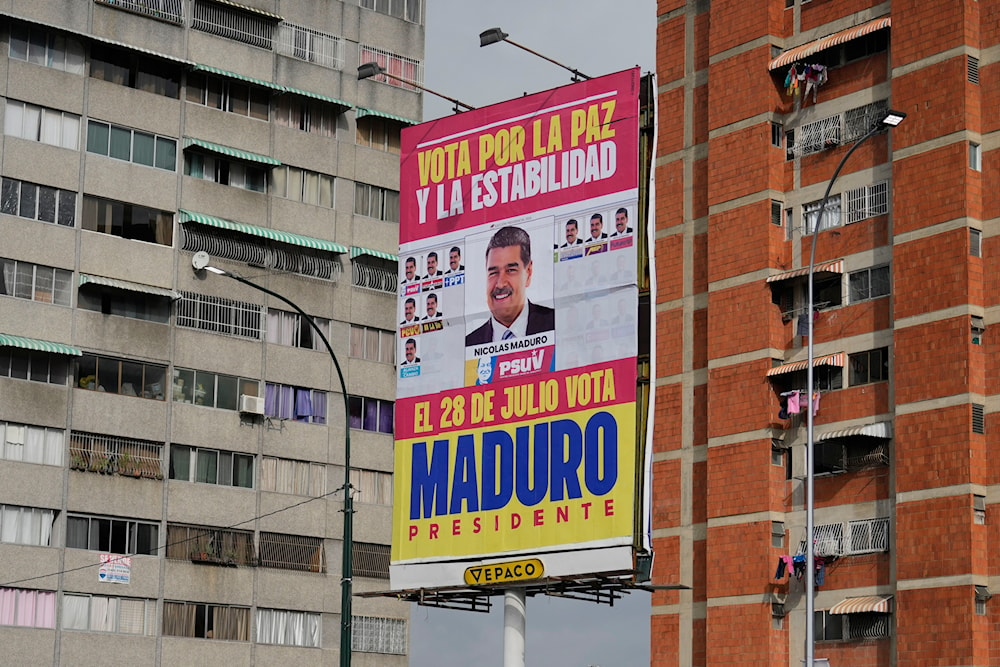 An election campaign sign for Venezuelan President Nicolas Maduro reads in Spanish 