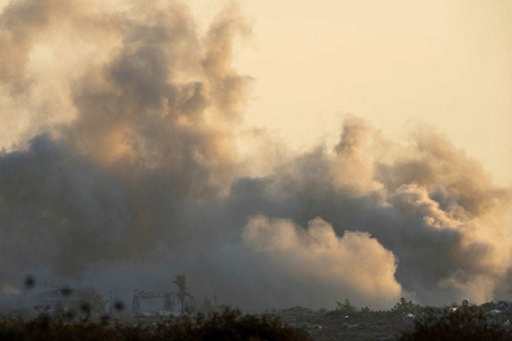 Smoke rises following an Israeli attack in the Gaza Strip as seen from southern occupied Palestine, Tuesday, July 23, 2024. (AP)