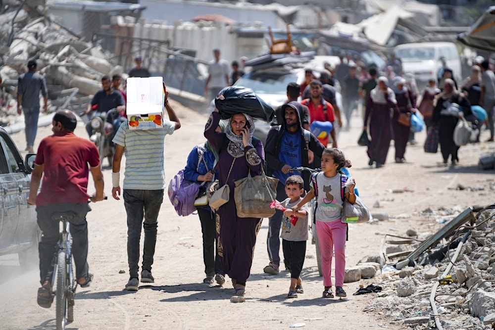 Palestinians displaced by the Israeli air and ground offensive on the Gaza Strip flee from parts of Khan Younis, Monday, July 22, 2024. (AP)