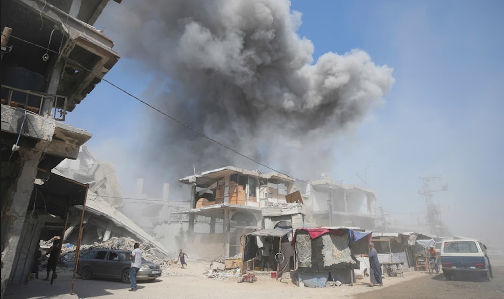 Smoke rises from buildings in Khan Younis after an Israeli airstrike on July 25, 2024. (AP)