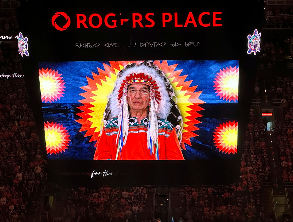 A First Nations land recognition video narrated by Chief Willie Littlechild plays on video screens prior to Game 3 of the Stanley Cup Final on Thursday, June 13, 2024, in Edmonton, Alberta. (AP)