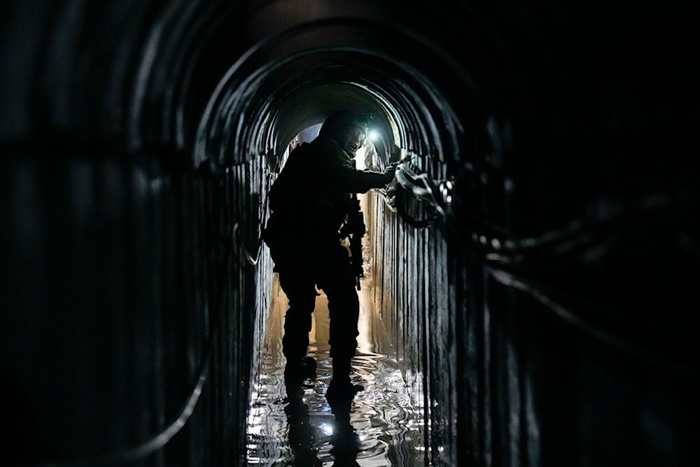 Israeli soldier walks in an electrical chamber underneath a UNRWA compound, alleged to have been used by Hamas in Gaza, Thursday, Feb. 8, 2024. (AP)