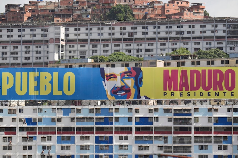 A campaign banner promotes President Nicolas Maduro in Caracas, Venezuela, Saturday, July 27, 2024. (AP)