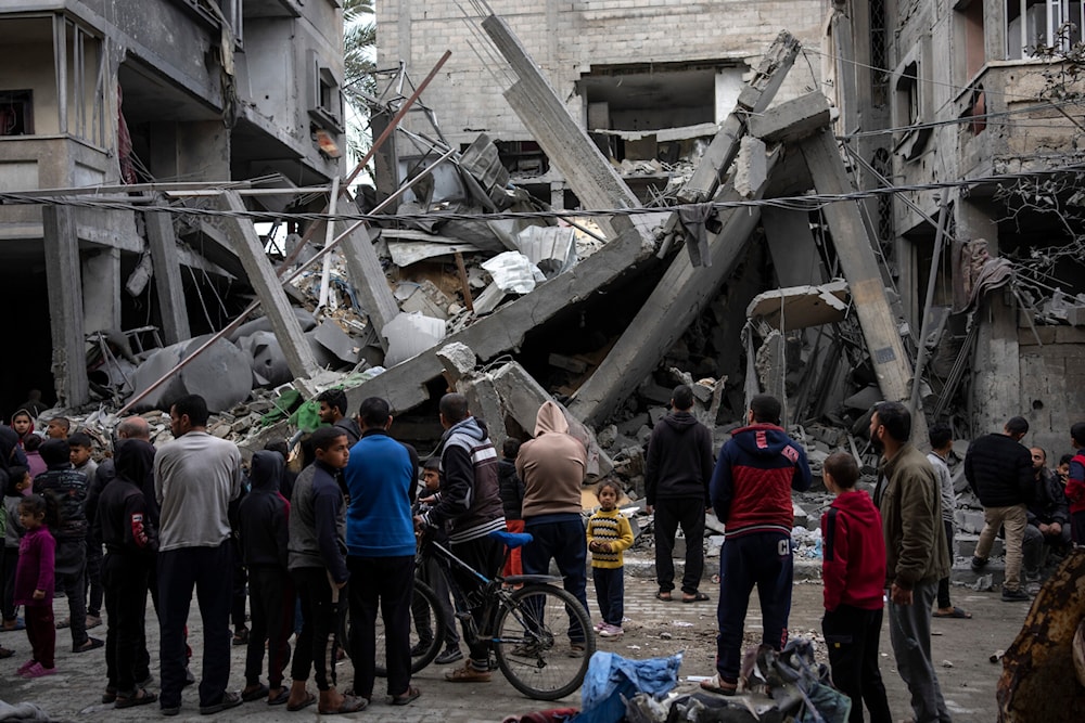 Palestinian families inspect the damage of residential buildings after an Israeli airstrike in Rafah, southern Gaza Strip, Sunday, March 24, 2024. (AP)