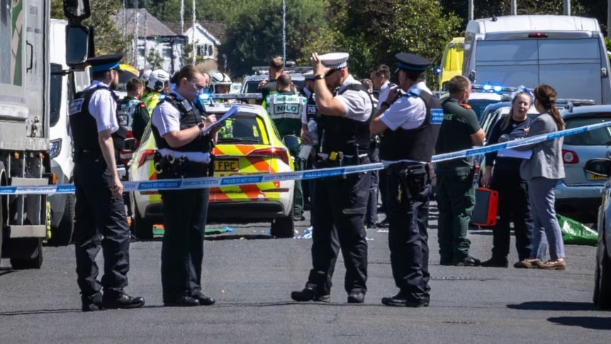 Police secure the scene of the stabbing in Southport, on England's north-west coast. (AP)