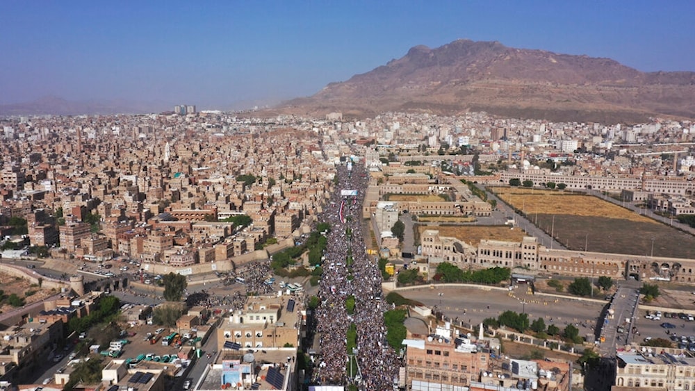 Ansar Allah supporters attend a rally marking the seventh anniversary of the Saudi-led coalition's intervention in Yemen's war, in Sanaa, Yemen, March 26, 2022.