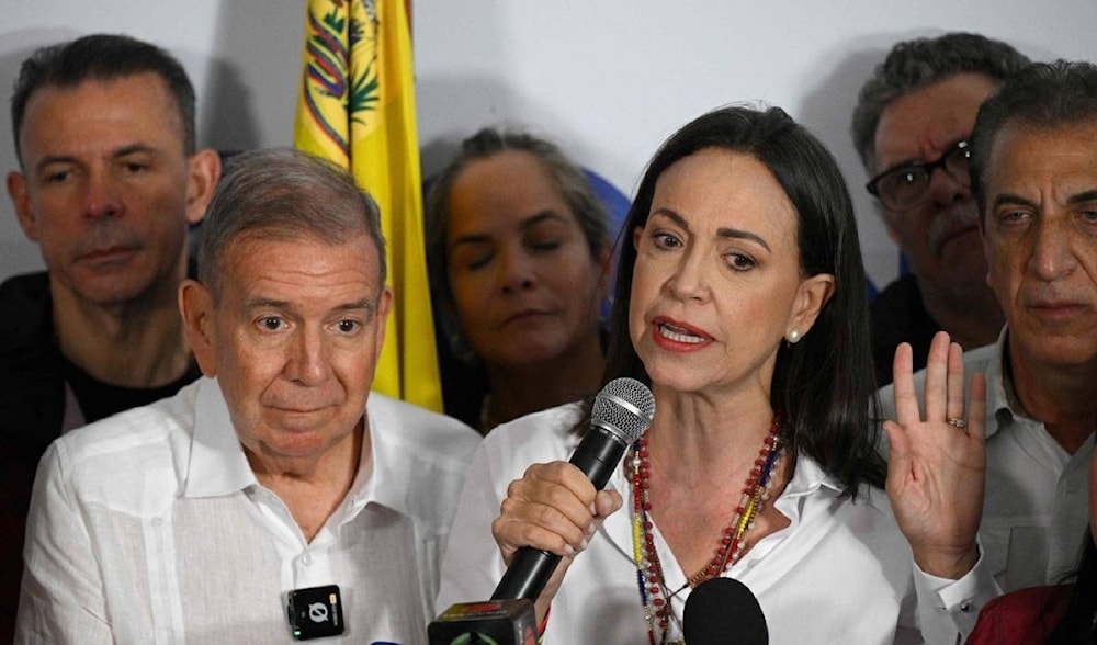 Venezuelan opposition leader Maria Corina Machado talks to the media, with opposition presidential candidate Edmundo Gonzalez Urrutia, following the election results in Caracas on July 29, 2024. (AFP)