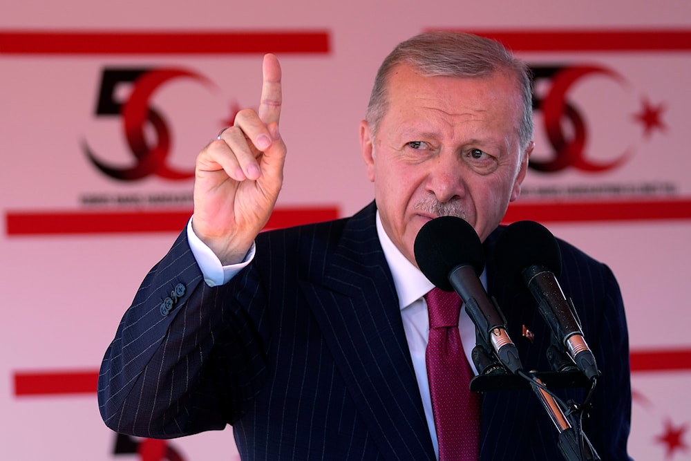 Turkish President Recep Tayyip Erdogan talks during a military parade in Nicosia on Saturday, July 20, 2024. (AP)