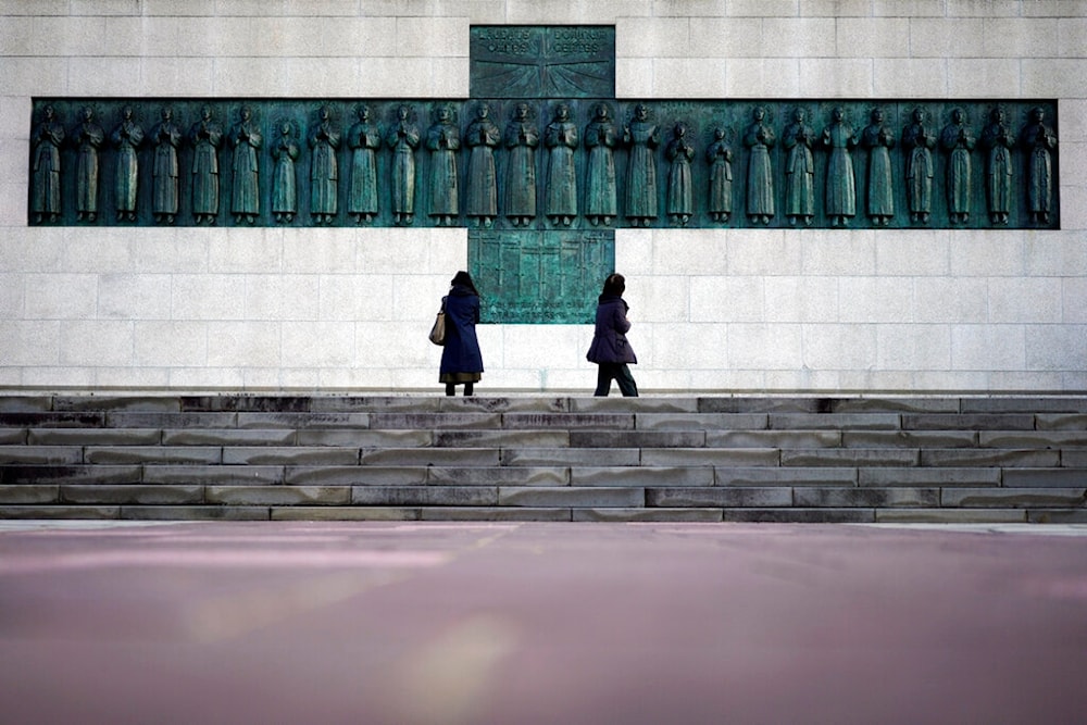  In this Nov. 17, 2019, file photo, people visit the Twenty-Six Martyrs Monument in Nagasaki, southern Japan. (AP)