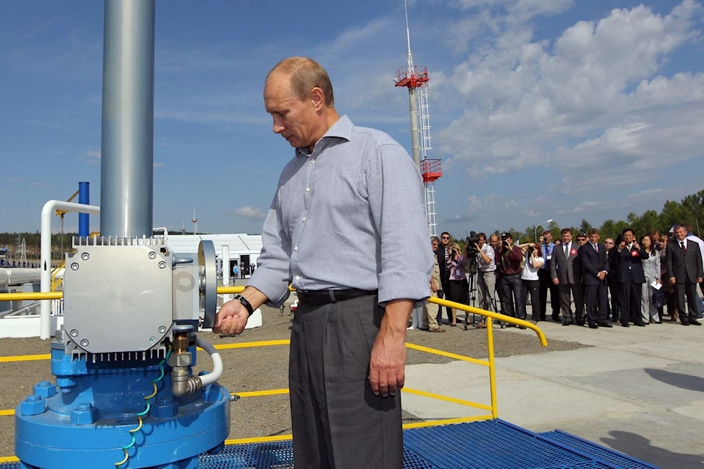 Vladimir Putin opens a throttle for the Russia-China oil pipeline, undated. (AFP)