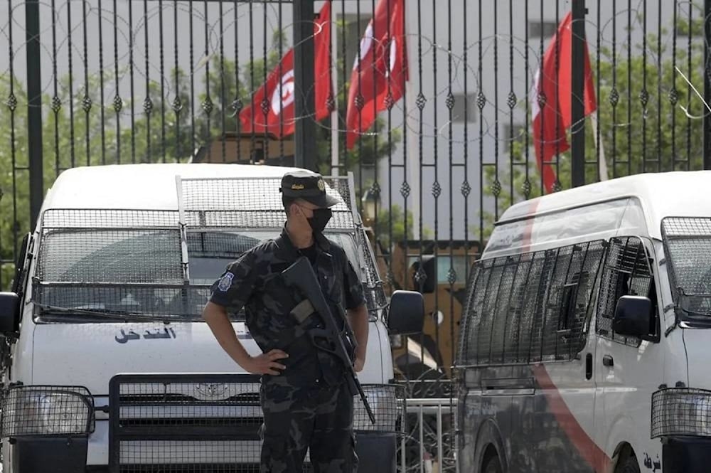 A police officer stands guard outside the parliament building in Tunis, undated. (AFP)