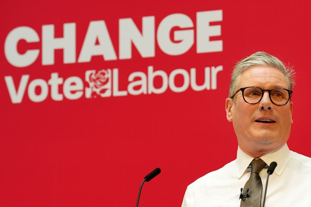 Britain's Labour Party leader Keir Starmer speaks on stage at the launch of the party's manifesto in Manchester, England, Thursday, June 13, 2024. (AP)