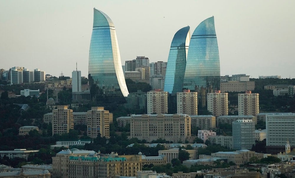 A general view of the city with the Flame Towers skyscrapers in background in Baku, Azerbaijan, Thursday, June 9, 2022. (AP)