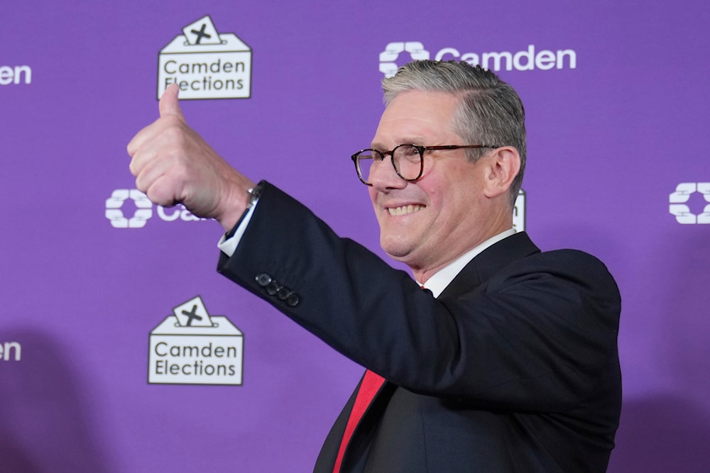 Britain's Labour Party leader Keir Starmer gives a thumbs up to his supporters after he was elected for the Holborn and St Pancras constituency, in London, on July 5, 2024. (AP)