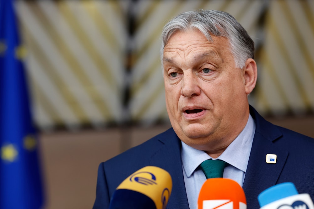 Hungary's Prime Minister Viktor Orban speaks with the media as he arrives for an EU summit in Brussels, Thursday, June 27, 2024. (AP)