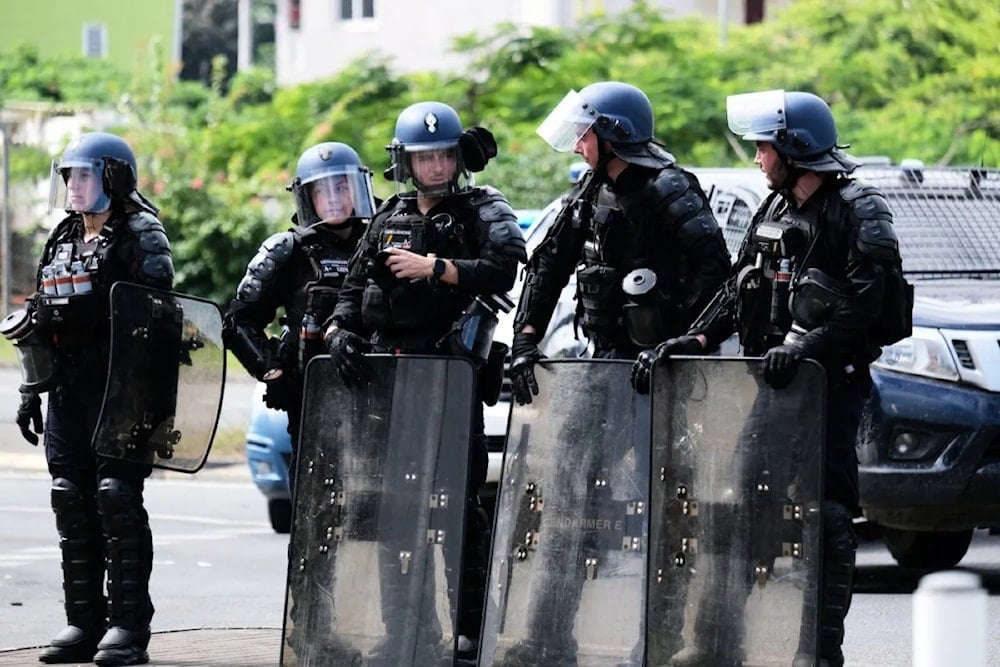 French riot police at the entrance of the Vallee-du-Tir district, in Noumea on MAY 2024. (AFP)