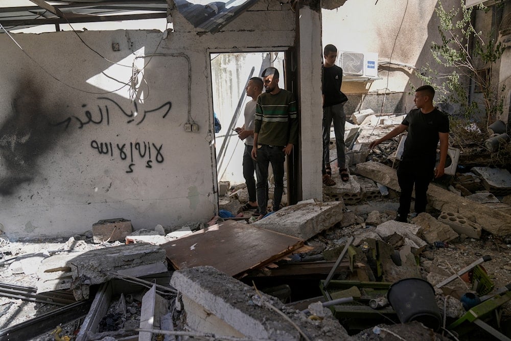 Palestinians inspect the damage in Al Fara'a refugee camp in the occupied West Bank following an Israeli military raid, on June 10, 2024. (AP)