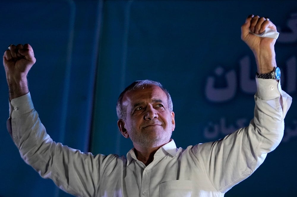 Reformist candidate for the Iran's presidential election Masoud Pezeshkian clenches his fists during a campaign rally in Tehran, Iran, on July 3, 2024. (AP)