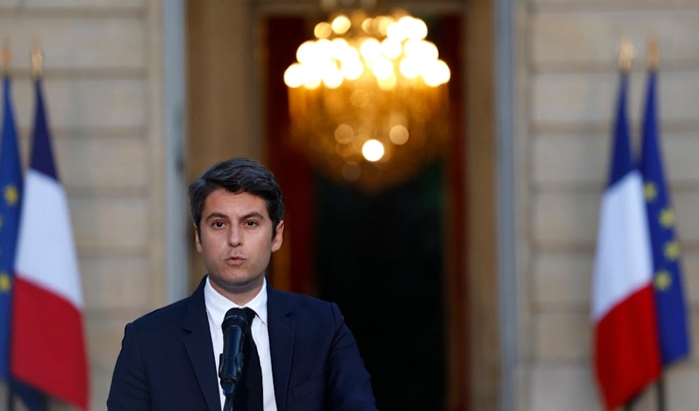 French Prime Minister Gabriel Attal delivers a speech after the second round of the legislative elections, Sunday, July 7, 2024, in Paris (AP)