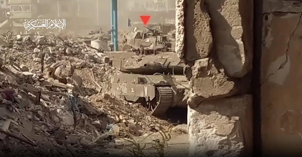 Al-Qassam Brigades attack an Israeli tank in the al-Shujaiya, east of Gaza city, occupied Palestine (Military media)