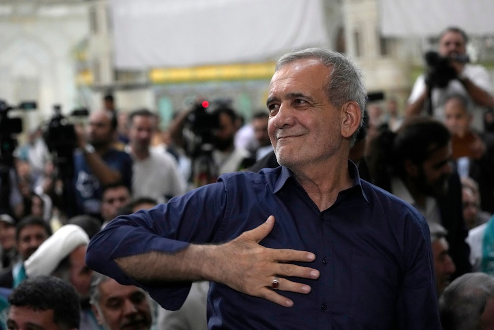 Iran's President-elect Masoud Pezeshkian greets his supporters in a meeting a day after the presidential election, at the shrine of the late revolutionary founder Ayatollah Khomeini, just outside Tehran, Iran, July 6, 2024 (AP)