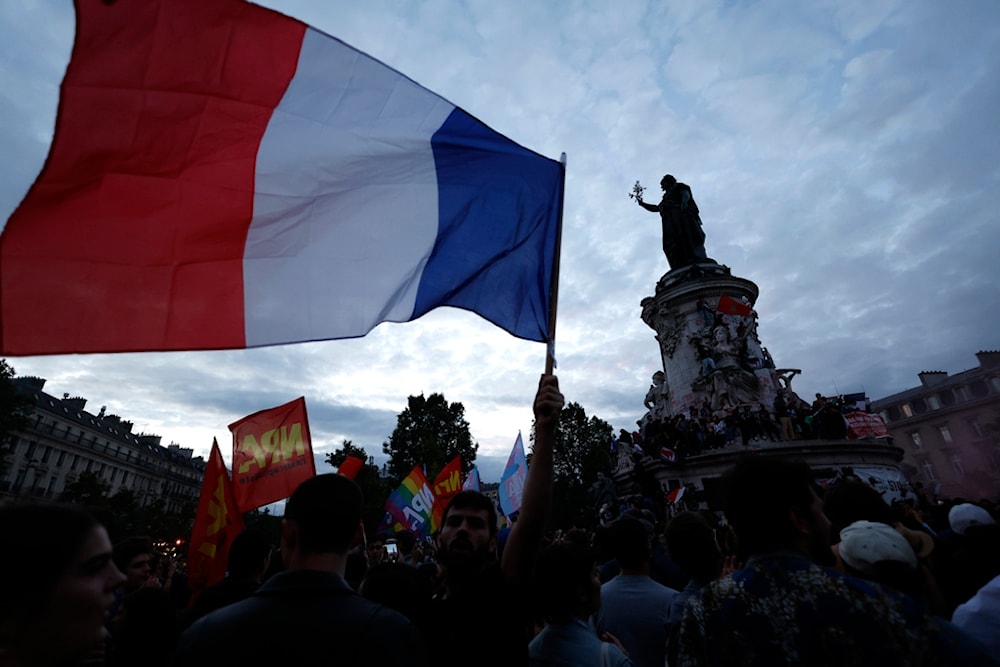 People gather on the Republique plaza following the second round of the legislative elections, Sunday, July 7, 2024 in Paris. (AP)