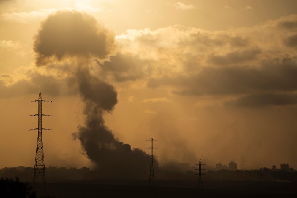 Smoke rises to the sky after an explosion in the Gaza Strip as seen from southern occupied Palestine, Monday, July 8, 2024. (AP)