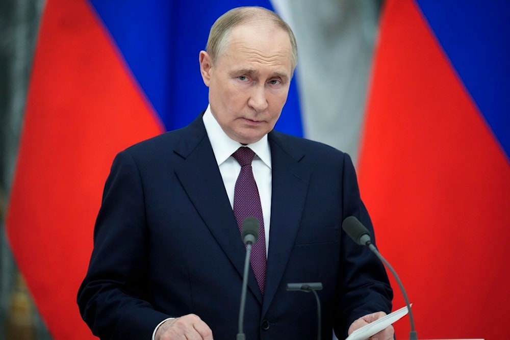 Russian President Vladimir Putin reads his press statement after the talks with Hungarian Prime Minister Viktor Orban in the Kremlin in Moscow, Russia, Friday, July 5, 2024. (AP)