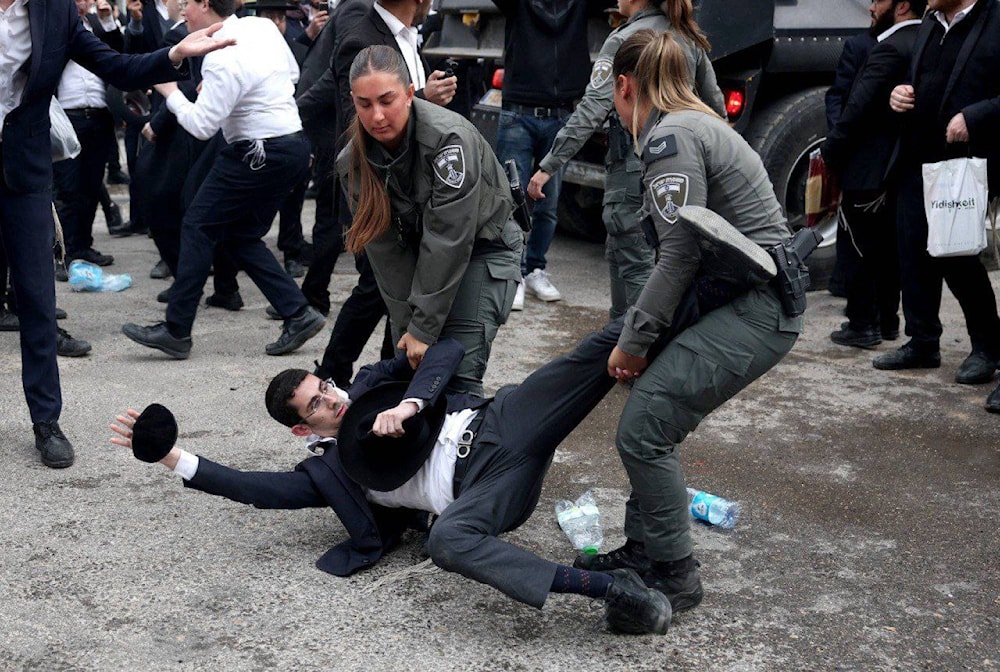 An ultra-orthodox is pictured protesting the new military draft. (@dana916)