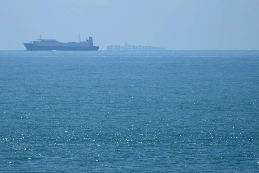 Ships move through the Taiwan Strait as seen from the closest point in mainland China to the island of Taiwan, in Pingtan in southeastern China's Fujian Province, on Aug. 5, 2022 (AP)