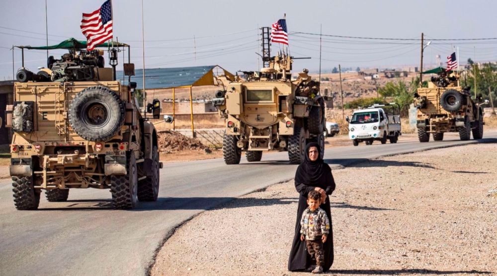 Illustrative: a convoy of US armored vehicles patrols the northeastern Syrian town of Qahtaniyah at the border with Turkey. (AFP)