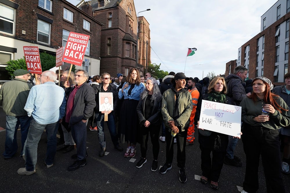 Counter protestors gather in Liverpool, on August 7, 2024. (AP)