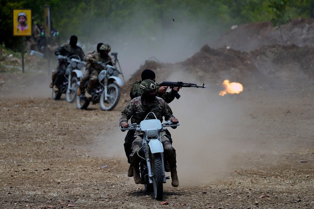 Fighters from the Lebanese militant group Hezbollah carry out a training exercise in Aaramta village in the Jezzine District, southern Lebanon, Sunday, May 21, 2023 (AP)